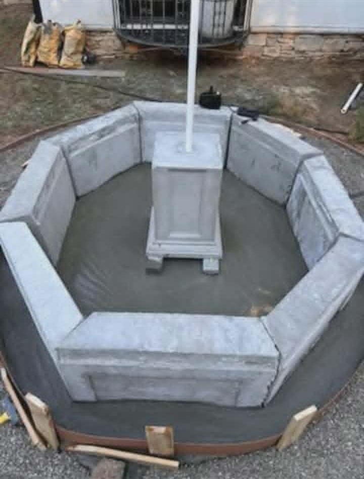 Octagonal basin walls assembled around the fountain base